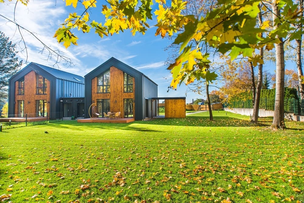 image of modern renewable home surrounded by trees