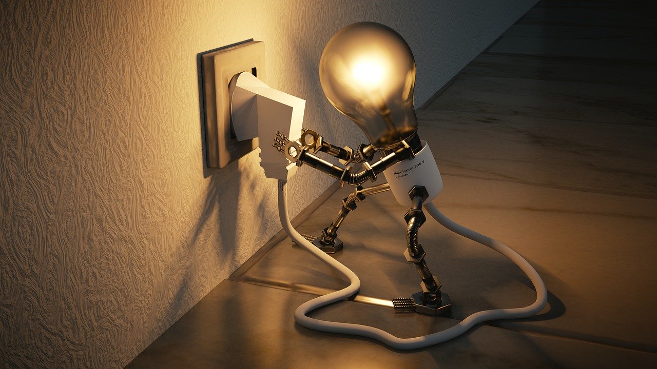 image of light bulb plugging itself in representing how we can save energy while staying home