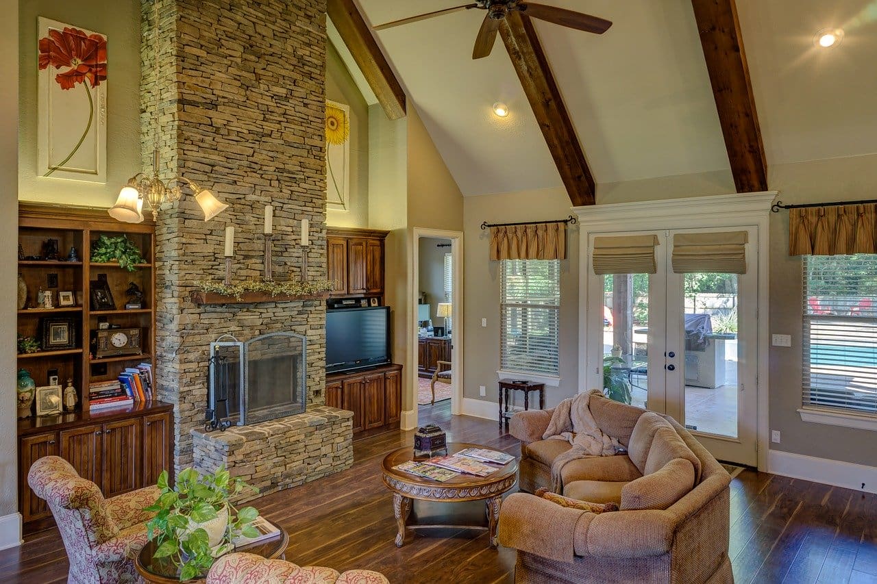 image of a living room with a fireplace representing warmth and cosiness and importance of heat pump maintenance