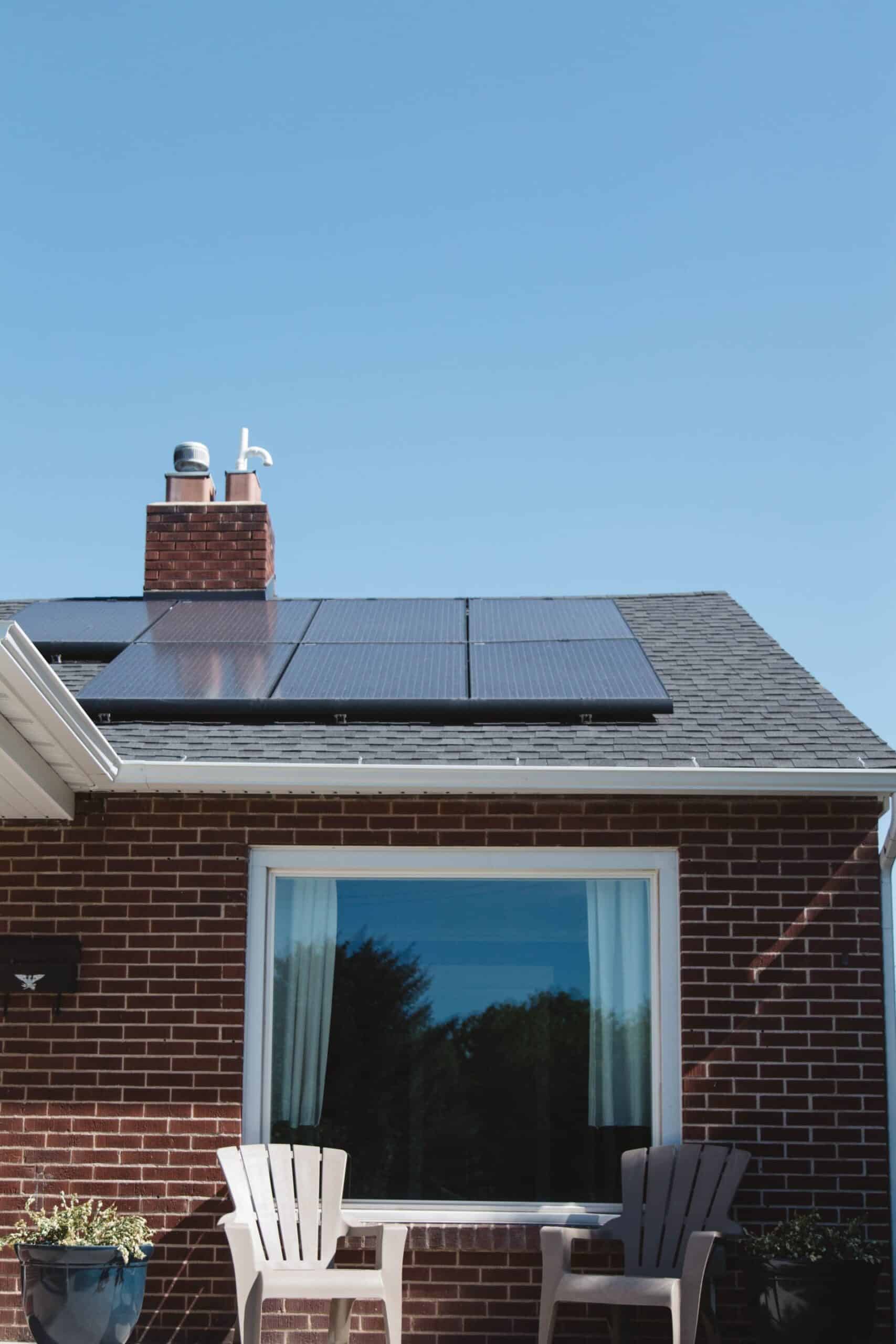 solar thermal vs solar pv, solar panels installed on the roof of a home