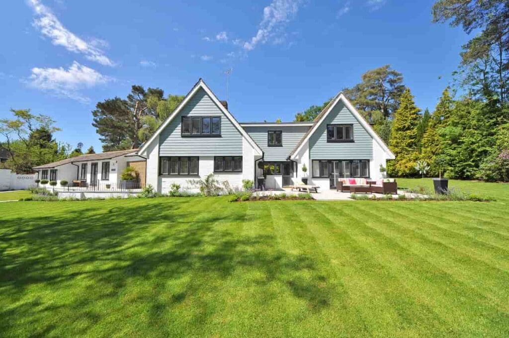 Heat Pump Refrigerant Check; a traditional style home with a massive backyard, surrounded by trees